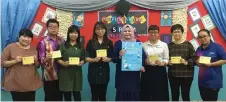  ??  ?? Roslawati (fourth right) holds a poster for the Mawar Dinner while posing with members of the organising committee showing tickets for the dinner.