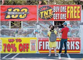  ?? BEN MARGOT/AP ?? Americans are keeping fireworks sellers, like one in Dublin, California, busy this summer.