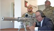  ?? (AFP) ?? Russian President Vladimir Putin aims a Chukavin sniper rifle, at the military Patriot Park in Kubinka, outside Moscow, on September 19