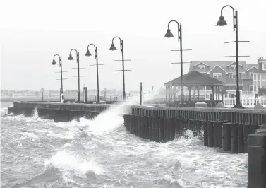  ?? Dale Gerhard/The Press of Atlantic City via AP ?? ■ High winds and rough surf pound the bulkhead on March 2 in Stone Harbor, N.J. A new report finds that high-tide flooding is happening across the United States at twice the rate it was just 30 years ago, and predicts records for such flooding will...