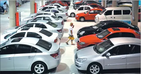  ?? YUE YUEWEI / FOR CHINA DAILY ?? Used cars are displayed in the airport economic area of the Tianjin Pilot Free Trade Zone.