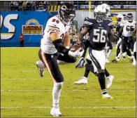  ?? AP/ LENNY IGNELZI ?? Chicago tight end Zach Miller catches a game- winning, 25- yard touchdown pass with 3: 19 left in the game to send the Bears to a 22- 19 victory over San Diego on Monday.