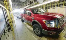  ?? ROGELIO V. SOLIS/AP PHOTO ?? A newly completed Titan rolls off the line at the Nissan Canton Vehicle Assembly Plant in Canton, Miss. America’s love of trucks and SUVs helped push most automakers to healthy sales gains in April 2016 as Honda and Nissan reported best-ever April sales.