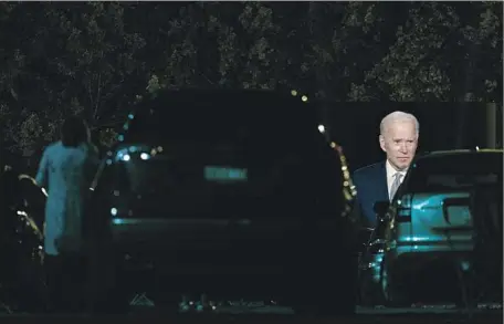  ?? Carolyn Kaster Associated Press ?? DEMOCRATIC candidate Joe Biden appears on a video screen during a “drive-in” town hall in Moosic, Pa. He said President Trump’s downplayin­g of the coronaviru­s threat was “next to criminal,” adding: “We have to be honest with the American people. They’re tough.”