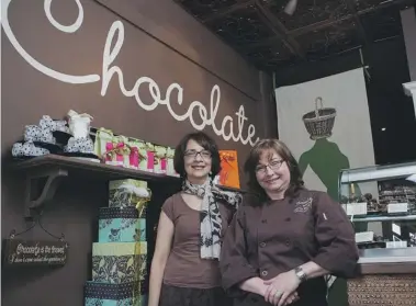  ?? MICHELLE SIU FOR NATIONAL POST ?? Lalita Krishna, left, created an iPhone app called Choco-locate that can sniff out chocolatie­rs
such as Toronto’s Chocolate by Wickerhead, owned by Sharon Shoot, right.