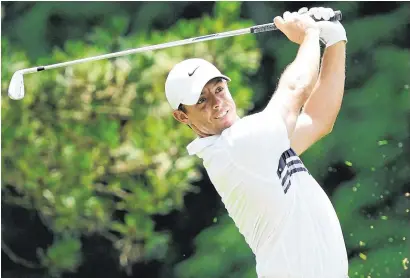  ?? USA TODAY SPORTS ?? Eye on the ball: Rory McIlroy follows his shot on the fifth hole at the Travelers Championsh­ip as he moved to nineunder par at the halfway point, four shots off the lead of Phil Mickelson