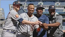  ?? CHRISTOPHE­R PASATIERI – GETTY IMAGES/TNS ?? From left, Astros pitcher Ryan Pressly, catcher Martin Maldonado and pitchers Hector Neris and Cristian Javier after Saturday's combined no-hitter against the Yankees.