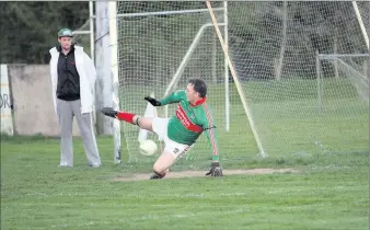  ??  ?? Rathnew’s Peter Dignam is beaten by Tony Hannon’s penalty in the SFL Division 1.