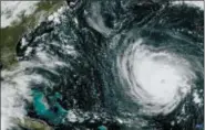  ?? NOAA VIA AP ?? This GOES East satellite image taken Tuesday at 10:30 a.m. EDT, and provided by NOAA shows Hurricane Florence in the Atlantic Ocean as it threatens the U.S. East Coast, including Florida, Georgia, South and North Carolina. Millions of Americans are preparing for what could be one of the most catastroph­ic hurricanes to hit the Eastern Seaboard in decades. Mandatory evacuation­s begin at noon Tuesday, for parts of the Carolinas and Virginia