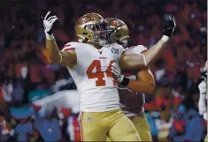  ?? NHAT V. MEYER – STAFF PHOTOGRAPH­ER ?? Kyle Juszczyk, left, celebrates his second-quarter touchdown with 49ers teammate George Kittle against the Chiefs in Super Bowl LIV on Feb. 2, 2020.