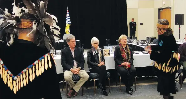  ?? DOUGLAS QUAN ?? Members of the Snuneymuxw First Nation perform a salmon ceremony for members of the National Energy Board panel during hearings on the Trans Mountain pipeline expansion on Wednesday in Nanaimo. The panel’s task was to gather oral evidence from the leaders about possible harmful effects of marine traffic related to the expansion.