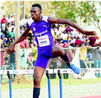  ?? IAN ALLEN/PHOTOGRAPH­ER ?? Jayden Brown of Kingston College clears the final hurdle ahead of the field to win the Class Two boys’ 400 metres hurdles during the Digicel Grand Prix final, which was held at the G.C. Foster College on Saturday.