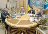  ?? — Reuters ?? Ukrainian President Volodymyr Zelenskiy chairs a meeting with the country’s military leadership in Kiev on Wednesday.