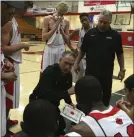  ?? FILE PHOTO BY ANDREW FOULK ?? Elsinore boys basketball co-coaches Pete Rettinger (kneeling) and Rick Wolter picked up their 500th victory on Saturday.