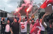  ?? PHOTOS: GETTY IMAGES ?? President Erdogan’s supporters celebrate outside the AK party headquarte­rs yesterday in Istanbul.