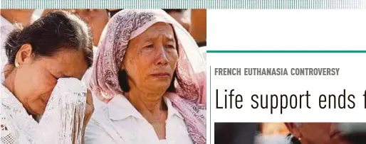  ?? AGENCY PIX ?? Women crying while watching the re-enactment of Khmer Rouge regime tactics in Phnom Penh yesterday.