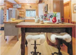  ??  ?? Right: Sheepskins cover old tractor seats at an old workbench used as the kitchen island.