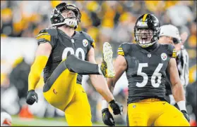  ?? Gene J. Puskar The Associated Press ?? Pittsburgh Steelers linebacker T.J. Watt, left, celebrates one of his four sacks in Monday’s win over the Cleveland Browns. Watt is one sack behind Michael Strahan for the NFL’S single-season record.