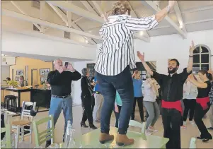  ?? SANDRA NOWLAN PHOTO ?? Opa! Guests table dance after lunch in Olympia.