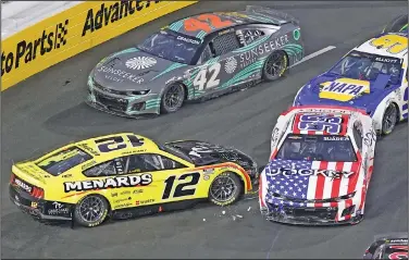  ?? Associated Press ?? Spin out : NASCAR Cup Series driver Ryan Blaney (12) spins out and is hit by Daniel Suarez (99) during the Busch Light Clash NASCAR exhibition auto race at Los Angeles Memorial Coliseum Sunday in Los Angeles.