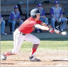  ?? PHOTO BY RICK PECK ?? McDonald County’s Jordan Platter bunts during the Mustangs’ 5-2 loss on March 18 to Harrison in the fifth place game of the Harrison Tournament.