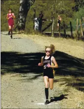  ?? PHOTO BY BRIAN SUMPTER ?? Nicole Pyzer of Middletown High School sets the pace during a cross country meet in September of 2019 at Six Sigma Ranch near Lower Lake.