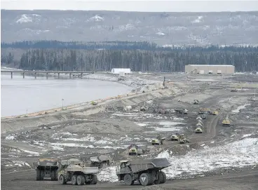  ?? JONATHAN HAYWARD / THE CANADIAN PRESS FILES ?? The Site C Dam along the Peace River in Fort St. John, B.C. A partnershi­p led by Aecon Group Inc. has been chosen as the preferred proponent for a Site C generating station.