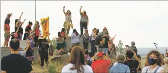  ??  ?? Protesters dance where the statue of Don Juan de Oñate used to be in Alcalde on Monday (June 15).