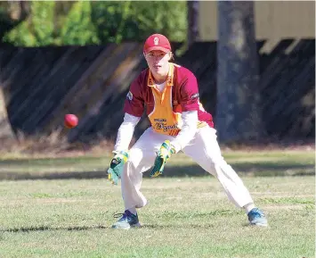  ?? ?? Liam Butterwort­h-Smith can only watch on as the ball races to the boundary well out of reach.