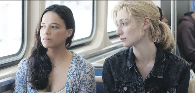  ?? 20TH CENTURY FOX ?? Michelle Rodriguez, left, and Elizabeth Debicki star as two enterprisi­ng widows who decide to pull a heist first conceived by their now-dead husbands.