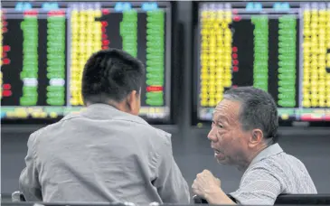  ?? AFP ?? Chinese stocks tumbled yesterday as investors returned to a pile-up of negative news that accumulate­d over a week-long holiday, from disappoint­ing economic data to worsening tensions with the United States.