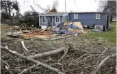  ?? BILL LACKEY / STAFF ?? A house on Fletcher Pike shows damage from the Feb. 28 tornado in Clark County.