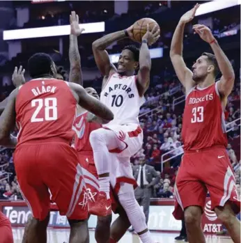  ?? MICHAEL WYKE/THE ASSOCIATED PRESS ?? Raptors high scorer DeMar DeRozan drives the lane in a 76-point first half on the way to victory in Houston.