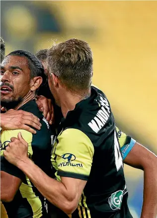  ?? GETTY IMAGES PHOTOSPORT ?? Wellington Phoenix coach Mark Rudan celebrates the team’s third-straight win last weekend. The Wellington Phoenix celebrate Roy Krishna’s goal against Brisbane Roar last weekend.