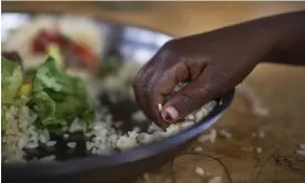  ?? Photograph: Jérôme ?? A girl eating in Dollow, Somalia. The UN projects that based on current trends, the number of people going hungry in Africa will rise to 310 million by 2030.