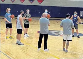  ?? COURTESY OF THE NORTH MIDDLESEX ATHLETIC DEPARTMENT ?? North Middlesex Regional boys players listen to coaches during Monday’s practice.