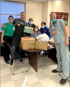  ?? COURTESY PHOTO ?? Pioneers Memorial Hospital staff accept a free lunch from Inferno restaurant in Brawley, courtesy of Imperial Valley agricultur­al organizati­ons.