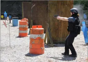  ?? SUBMITTED PHOTO ?? Ginger Rae Dunbar shoots at a threat during Basic SWAT School.