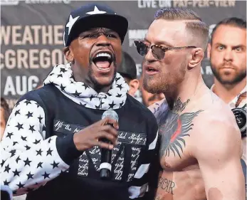  ?? NOAH K. MURRAY, USA TODAY SPORTS ?? Even though Conor McGregor, right, is left-handed, Floyd Mayweather Jr. is still the likely overwhelmi­ng favorite.