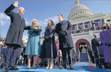  ?? AP ?? Joe Biden is sworn in as President as First Lady Jill Biden holds the Bible during the inaugurati­on ceremony at US Capitol.