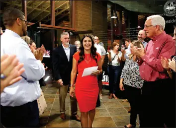  ?? SARAH PHIPPS / ASSOCIATED PRESS FILE (2020) ?? State Sen. Stephanie Bice is applauded by supporters as she walks into her watch party to speak Aug. 25, 2020, after winning the Republican runoff election for the 5th Congressio­nal District seat in Oklahoma City.