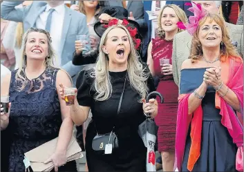  ??  ?? Cheering on the horses was the order of the day as these ladies looked to back a winner