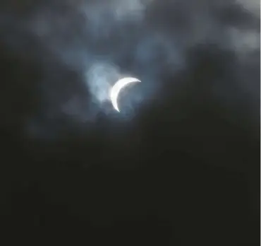  ?? RICH ROLEN/SPECIAL TO THE MORNING CALL ?? A partial eclipse is seen Monday from Fountain Hill.