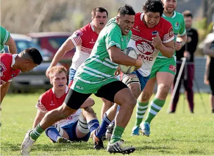  ?? PHOTO: MURRAY WILSON/FAIRFAX NZ ?? Manawatu Developmen­t midfielder Jaxon Tagavaitau tears through the Horowhenua-kapiti defence at Bunnythorp­e on Saturday.