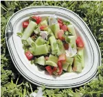  ??  ?? Tomato, cucumber and purslane salad, sitting a bed of white purslane.