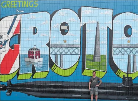  ?? SARAH GORDON/THE DAY ?? Artist Jacob Cullers with his mural at Outer Light Brewing Company in Groton.