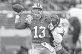  ?? TONY AVELAR/AP ?? 49ers quarterbac­k Brock Purdy passes as Buccaneers linebacker Devin White applies pressure during the first half in Santa Clara, Calif., on Dec. 11.