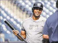  ?? Lynne Sladky / Associated Press ?? The Yankees’ Aaron Hicks smiles as he takes batting practice before a spring training baseball game against the Toronto Blue Jays on Monday in Tampa, Fla.