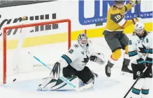  ?? John Locher / Associated Press ?? Vegas’ Reilly Smith (19) jumps out of the way as a shot by Nicolas Hague eludes San Jose goalie Devan Dubnyk.