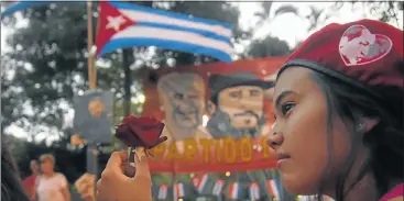  ?? Picture: AFP ?? SALUTE TO ‘EL COMANDANTE’: Supporters of Paraguay’s Communist Party gather in Asuncion to pay tribute to Cuban revolution­ary leader Fidel Castro on Saturday, a day after his death in Havana